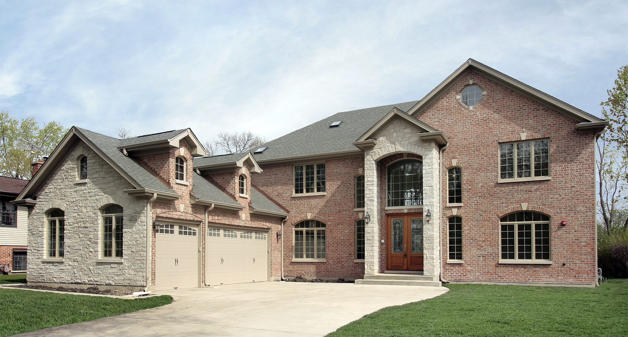 Luxury custom home exterior at golden hour